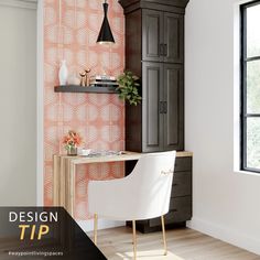 a room with a desk, chair and cabinet next to a wallpapered wall