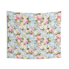 a blue floral wall hanging tapestry with pink and white flowers