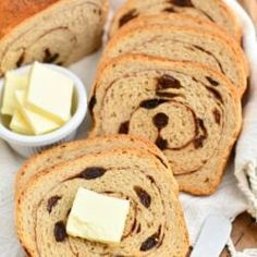 slices of bread with butter and raisins on top