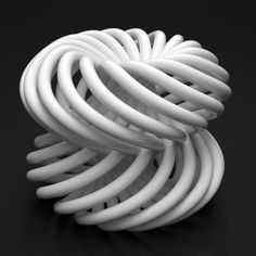 a white coiled object sitting on top of a black surface