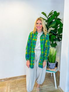 When the vacation vibes are calling, the Vacation Booked Button Down is the answer! With its playful blue and green hues, this lightweight shacket is your go-to for layering over anything from a chic jumpsuit to your favorite jeans. Perfect for breezy fall days, it’s an effortless addition to your wardrobe that’s as versatile as it is stylish. Wear it for a stroll through a fall farmers market or to cozy up at a weekend bonfire, and let this button-down become your ultimate travel companion. PRO Spring Relaxed Fit Shacket For Day Out, Casual Cotton Shacket For Day Out, Trendy Green Long Sleeve Shacket, Casual Long Sleeve Shacket For Day Out, Green Relaxed Fit Cotton Shacket, Casual Beach Outerwear, Green Button-up Outerwear For Day Out, Spring Button-up Shacket For Day Out, Trendy Green Summer Outerwear