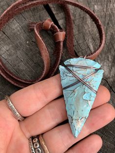 "This is my fresh spin on a wire wrapped classic. Arrowheads have been worn as jewelry for ages and are a recognizable symbol of alertness, walking the straight and narrow & strength. The arrowhead I used is made of jasper stone and is a hand knapped modern replica. It was made in the same tradition and with the same primitive techniques that early man used. I added a lovely pale turquoise & gold highlight patina then wire wrapped it with blackened (oxidized) copper wire. This is a great Adjustable Southwestern Turquoise Pendant Necklace, Adjustable Southwestern Hand Wrapped Jewelry, Southwestern Adjustable Hand Wrapped Jewelry, Southwestern Hand Wrapped Adjustable Jewelry, Artisan Adjustable Turquoise Pendant Necklace, Adjustable Southwestern Style Hand Wrapped Jewelry, Southwestern Arrowhead Jewelry Gift, Southwestern Style Arrowhead Jewelry Gift, Handmade Adjustable Southwestern Turquoise Necklace