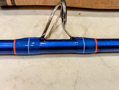 a blue and orange pen sitting on top of a counter