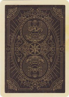 the back side of a playing card with an intricate design on it and gold foil