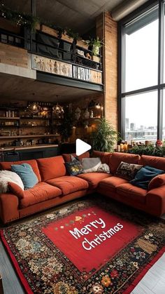 a living room filled with lots of furniture and large windows overlooking a cityscape