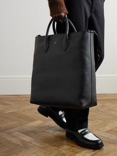 DESIGNED BY MR PORTER. Mr P.'s tote bag is a smart, practical choice for the office. Sized for your laptop, notebook and paperback, it's made from full-grain leather and has an adjustable shoulder strap for easy carrying. Tuck your business cards and chargers in the internal zipped pocket. Designer Tote Briefcase For Business, Designer Business Briefcase Tote, Designer Business Laptop Bag Tote, Business Briefcase With Dust Bag, Tote Style, Designer Briefcase With Removable Pouch For Work, Modern Laptop Bag With Smooth Grain For Daily Use, Modern Office Briefcase With Dust Bag, Functional Business Bag With Smooth Grain, Business Tote Bag With Smooth Grain