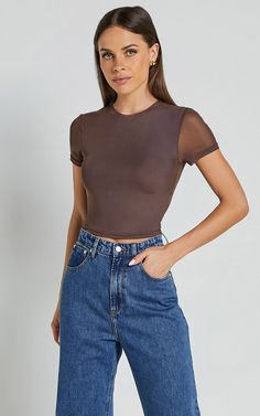 Unleash your inner style goddess with our Rhianna Top! This short sleeve mesh crop top in brown is the perfect addition to your casual wardrobe. Made from high-quality polyester, this fashion-forward piece features a crew neckline and a flattering cropped length. Whether you're heading out for brunch or hitting the dance floor, this trendy top will have you looking effortlessly cool and confident. Pair it with high-waisted jeans or a skirt for an edgy yet chic ensemble that's sure to turn heads. Sheer Short Sleeve T-shirt, Casual Mesh Short Sleeve Crop Top, Casual Sheer Mesh Crop Top, Fitted Brown Crop Top With Short Sleeves, Brown Fitted Short Sleeve Crop Top, Fitted Brown Short Sleeve Crop Top, Sheer Short Sleeve Crop Top For Night Out, Brown Stretch Summer T-shirt, Trendy Short Sleeve Mesh Top For Night Out