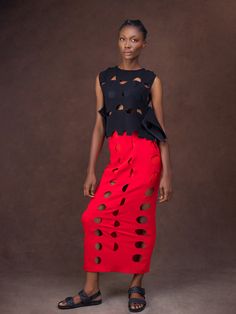 At once glamorous, playful, and empowering, this two-piece set captures the unique design aesthetic of Nigerian label Gozel Green. Comprising a sleeveless peplum top and a midi skirt, it’s been handcrafted in Lagos, Nigeria, from lightweight crepe infused with a touch of stretch to ensure comfort. Finished with skin-baring cutouts and scalloped edges for a touch of ladylike finesse, style yours with metallic heels and a swipe of red lipstick. - Two-piece set - Sleeveless top with a round neck, c Chic Midi Dress With Ruffles, Avant-garde Fitted Skirt For Summer, Chic Skirt Set For Summer Evening, Chic Evening Skirt Set For Summer, Chic Summer Evening Skirt Set, Chic Summer Party Skirt Set, Sleeveless Skirt Set For Spring, Chic Spring Evening Skirt Set, Modern Skirt For Summer Parties