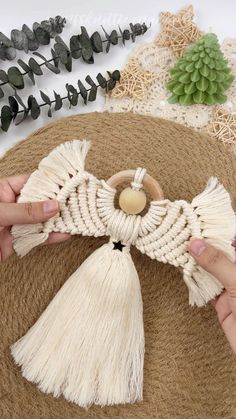 various crafting supplies laid out on top of a round tablecloth with scissors, twine and spools