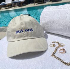 Oui, oui! Say Bonjour to your new everyday essential with our exclusive Hail The Maison seasonal cap. Dreamt of in France, Designed in house and made in California, we couldn’t be more proud of these chic beauties to celebrate the nostalgic life with. Created with 100% Cotton, Hand embroidered and made with care. * Sandy colored base with royal blue embroidery * One size fits most * Self-fabric strap with hook and loop closure* Soft hand feel with brushed look Cap Pics, Royal Blue Fashion, Cotton Trucker Hat, Aesthetic Caps, Urban Cotton Trucker Hat With Embroidered Logo, Fun Cotton Trucker Hat, Embroidered Cotton Trucker Hat, Merch Ideas Products, Cotton Baseball Cap With Embroidered Text