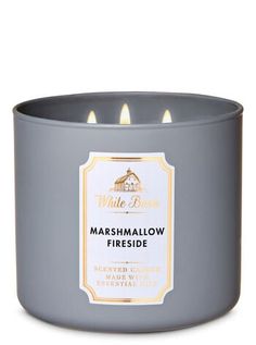 a candle that is in a grey container