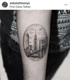 a black and white photo of a cityscape in a circle on the arm