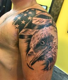 a bald eagle with an american flag tattoo on his arm