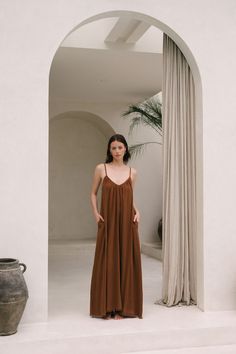 A favorite silhouette, reimagined in new colorways for summer. The Sonja is a relaxed maxi dress crafted from soft cotton gauze with a raw hem. Featuring adjustable spaghetti straps, inseam pockets and an optional belt. An everyday staple for the warmer months, we love to pair Sonja with a hat and simple sandal. Unlined Relaxed Fit Maxi Dress, Relaxed Fit Unlined Maxi Dress, Brown Summer Loungewear Dress, Unlined Maxi Dress For Summer Loungewear, Summer Loungewear Maxi Dress Unlined, Chic Summer Maxi Dress With Slip Pockets, Unlined Spaghetti Strap Maxi Dress For Daywear, Relaxed Fit Unlined Sundress Maxi Dress, Unlined Summer Maxi Dress For Loungewear