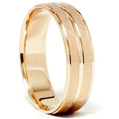 a gold wedding ring with three thin lines on it