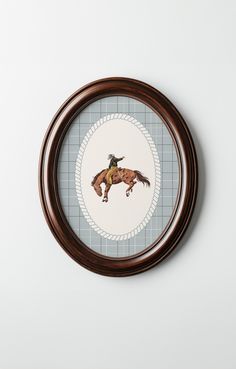 a painting of a horse with a cowboy hat on it's head in a frame