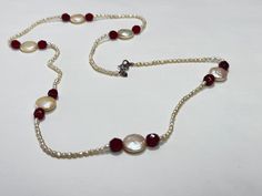 This elegant handmade necklace features natural pearls paired with sparkling crystals, creating a timeless and sophisticated look. The lustrous pearls are beautifully complemented by deep red crystals, adding a pop of color to the classic design. Finished with a sterling silver clasp, this necklace is perfect for both formal occasions and everyday wear. The natural beauty of the pearls, combined with the handcrafted quality, makes this piece truly special. Whether you're looking for a unique gif Natural Pearl, Red Crystals, Sparkling Crystal, Handmade Necklace, Natural Pearls, Handmade Necklaces, Crystal Necklace, Handmade Natural, Charm Necklace