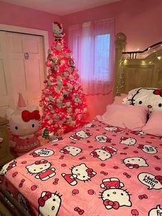 a hello kitty themed bedroom with pink walls