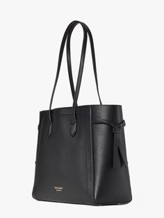 meet our knott tote. you'll notice it has clever cinched knotted sides but that's not the only reason it earned its name. a snap-tab slip pocket organizes all the little things. there's room enough to fit your essentials even a 13 laptop. it's the bag that ties it all together. | Kate Spade Knott Large Tote, Black Elegant Daily Use Bag With Loop Closure, Kate Spade Knott, Kate Spade Outlet, Black Leather Bag, Large Leather Tote, Gold Bag, Black Leather Bags, Kate Spade Handbags, Boot Bag