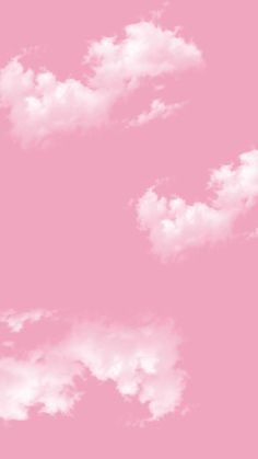 the sky is pink and white with clouds in it, as well as an airplane