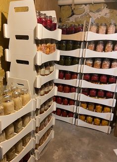 the shelves are filled with jars and containers