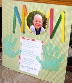 a child's handprinted photo on a bulletin board with colored crayons