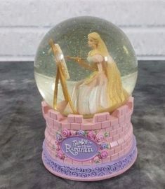 there is a snow globe with a princess in it