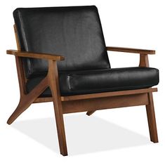 a brown leather chair sitting on top of a wooden frame