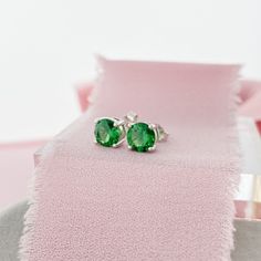 Sterling Silver 6mm Stud earring set with an Emerald CZ. Get size and impact without the price of an Emerald or Diamond. The rich green color is perfect for those born in May! D E T A I L S * 6mm Round CZ * Butterfly Push Back * Sterling Silver * 11mm Post More Stud Earrings * https://etsy.me/3buPBpX Green Birthstones * https://etsy.me/2wFYE7S Birthstone Styles * https://etsy.me/39dsZsN More Earrings * https://etsy.me/2wZKa2D More From Our Shop * https://etsy.me/2vasKjo Are you new to Etsy? Shop Green Stud Earrings, Infinity Knot Ring, Wedding Ring Finger, Born In May, North Star Necklace, Love Knot Ring, Solitaire Studs, Gold Filled Ring, Rich Green