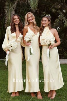 three bridesmaids in yellow dresses posing for the camera with flowers on their bouquets