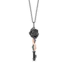 From the Enchanted Disney Fine Jewelry Villains Collection inspired by Maleficent, this diamond key pendant reveals your dramatic flair. Fashioned in sterling silver with black rhodium plate and 10K rose gold, this elegant design features a sandblast-textured rose top lightly adorned with alluring enhanced black diamonds. Rose gold and black rhodium vines twist along the while additional enhanced black diamonds glisten beside the bit. Radiant with 1/8 ct. t.w. of diamonds and a brilliant buffed Black Diamond Pendant, Enchanted Disney, Enchanted Disney Fine Jewelry, Disney Fine Jewelry, Disney Jewelry, Key Pendant, Sterling Silver Necklace Pendants, Maleficent, Disney Villains