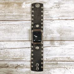 Channel your inner Rockstar with this black bison leather cuff band. It's made with a single layer of high quality, sturdy leather and encrusted with silver studs for a unique look! Cuff Band Black bison leather Embellishments and Adapters will be matched to Watch Color Approximately 1.75" wide Adjustable snap closure Bison Leather, Stud Muffin, Leather Cuffs, Silver Studs, Apple Watch Bands, Leather Watch