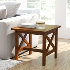 a living room scene with focus on the end table and sofa in the background,