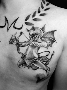 a black and white photo of a man with a demon tattoo on his chest holding an arrow