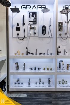 a display case filled with lots of different types of faucets and shower heads