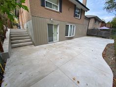 a concrete patio in front of a house