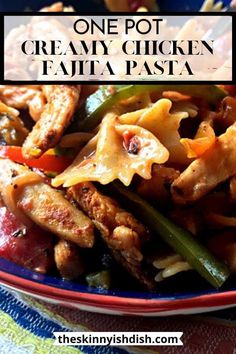 one pot creamy chicken fajita pasta in a blue bowl with text overlay