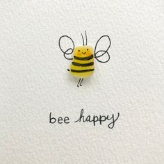 a drawing of a bee with the words be happy written on it's side