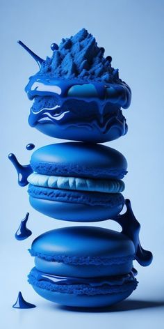 a stack of blue macaroons sitting on top of each other