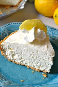 a slice of lemon pie on a blue plate