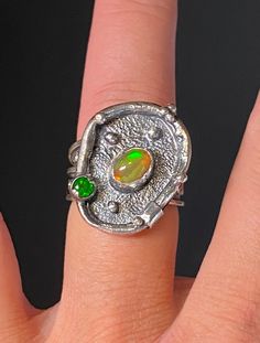 Ethiopian Opal Gemstone Ring in sterling silver size 7 Materials: Silver 925, Ethiopian Opal, Chrome Diopside  Face of the ring: Height-22mm, Width-18mm, Band-11-3mm Unique Handcrafted One-of a-kind Design Ring Each Piece of Jewelry in my Collection is Absolutely One of a Kind! When you start wearing a piece of my jewelry you will fall in love with it more and more each day and feel that good Energy and Love that I pass into it while creating this piece of Art. A piece of Art created for you to Fusion Style Oval Sterling Silver Gemstones, Unique Green Opal Promise Ring, Fusion Style Round Opal Ring, Silver Multi-stone Opal Ring As Gift, Unique Silver Sterling Silver Birthstone Ring, Artisan Sterling Silver Oval Rings, Unique Oval Opal Ring For Jewelry Making, Unique Silver Sterling Birthstone Ring, Unique Silver Birthstone Ring In Sterling Silver