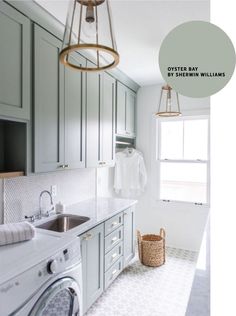 a kitchen with gray cabinets and white counter tops is featured in this color scheme for the laundry room