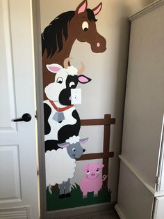 the door is decorated with farm animals on it