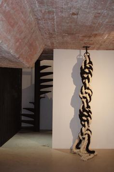 a black and white sculpture hanging from the ceiling