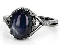 4.83ct Oval Cabochon Blue Star Sapphire Black Rhodium Over Sterling Silver Solitaire Ring. Measures Approximately 0.41"L x 0.47"W. Not Sizeable. Elegant Cat Eye Gemstone Jewelry, Blue Gem Ring, Rings Blue, Blue Star Sapphire, Star Sapphire, Gem Ring, Blue Gems, Black Rhodium, Blue Star