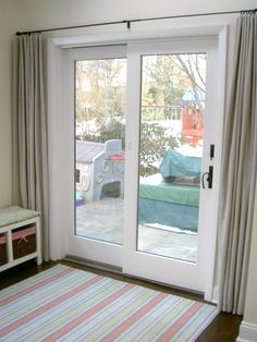 a living room with sliding glass doors leading outside