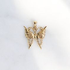 "What if I fall? ....Oh but my darling, what if you fly?" Give her the gift of wings with this beautiful butterfly necklace.DETAILS- 14k yellow gold butterflyVARIATIONSIf you require any variation of this style (a different style chain, longer chain, etc.) feel free to message us. We will do our best to accommodate you. Additional costs may apply depending on the variation.POLICYWe do accept returns on this item minus a $25 restocking fee. Return shipping is the responsibility of the buyer. Any 14k Yellow Gold Butterfly Pendant Necklace, 14k Gold Butterfly Pendant Necklace, 14k Gold Butterfly Charm Pendant Necklace, 14k Gold Butterfly Necklace Pendant, 14k Gold Butterfly Necklace Fine Jewelry, 14k Gold Butterfly Necklace, With Brave Wings She Flies, What If I Fall, Gold Butterfly Necklace