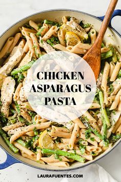 chicken asparagus pasta in a skillet with a wooden spoon