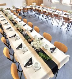 a long table is set up with place settings