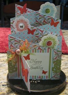 some cards are stacked on top of each other with the words happy birthday written on them